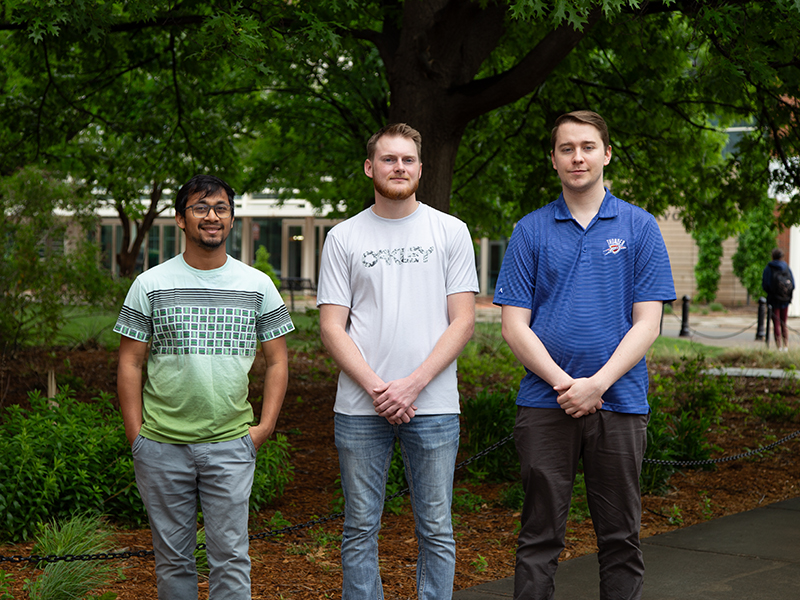 Feng's research students standing for a photo outside on OSU campus. 