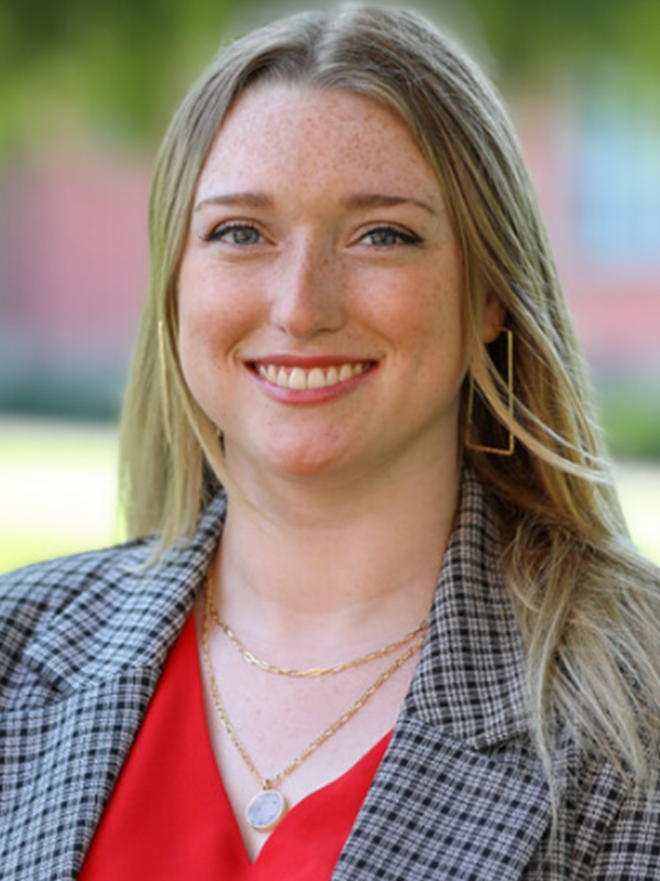 A headshot of a woman with blonde hair.