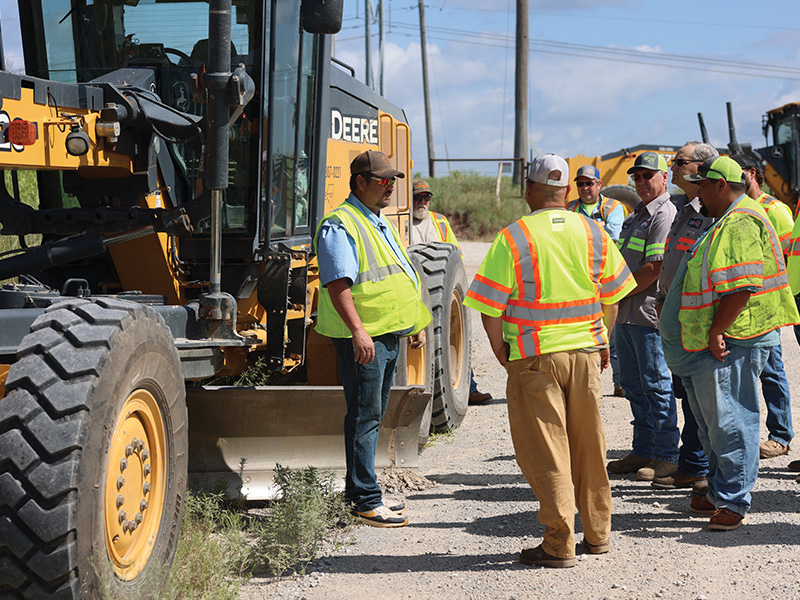 Employees of the Oklahoma Department of Transportation listen to an instructor give details on motor grader training the ODOT employees took part in through CEAT Professional Development