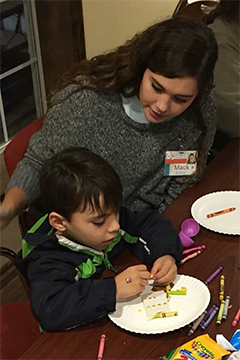 Student working with a child