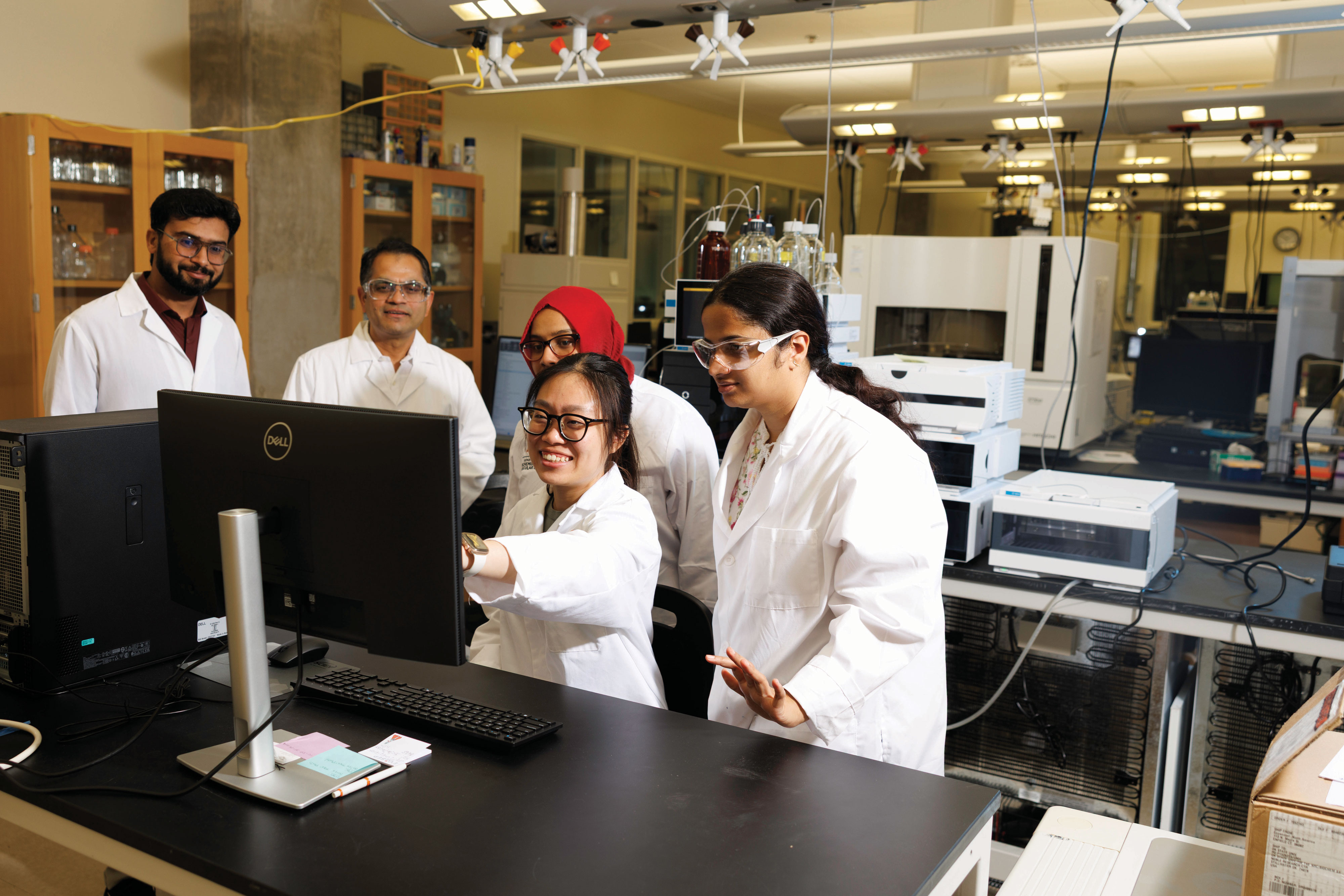 From left: Dr. M. Ali, senior proteomics research scientist; Dr. Uma Aryal; Israt Mishu, graduate student in the Aryal lab; and Drs. Pei Jia Ng and Punyatoya Panda, postdoctoral researchers in the Aryal Lab, review and evaluate mass spectrometry data acquired for protein analysis.