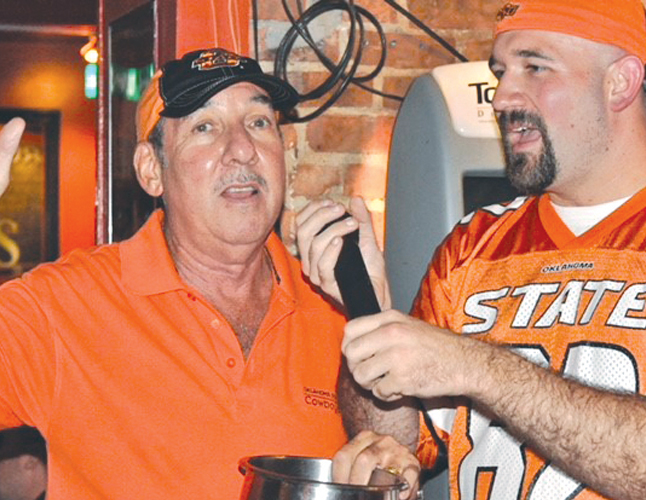 Ken Kinzer helps emcee an event for OSU alumni in New York City.