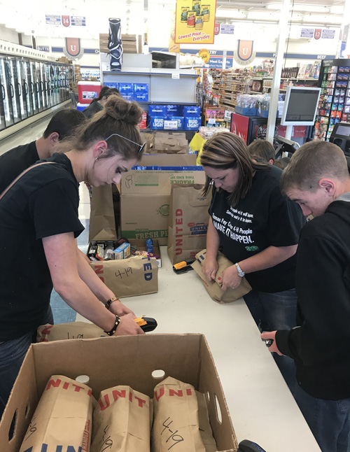 4-H club members gathering supplies