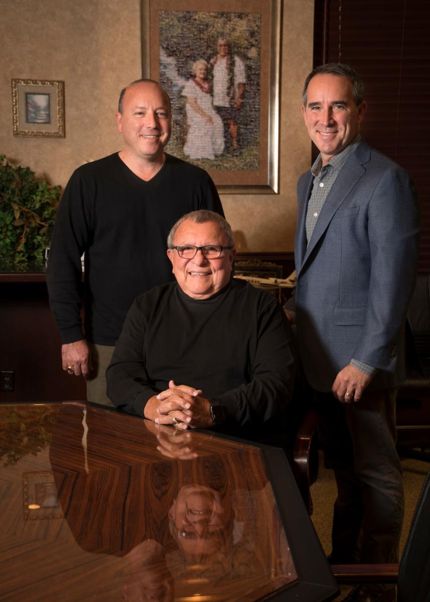 John P. Lopez, left, chief operating officer; his brother and vice president of operations, Dave Lopez; and their father, John C. Lopez, seated, founder and chairman emeritus.
