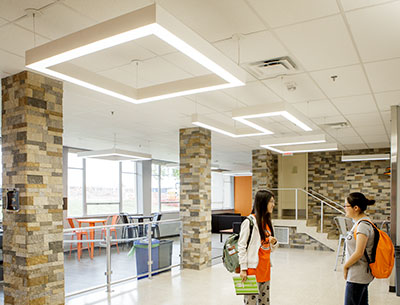 Eye-catching lights that spell out O-S-U in the ceiling greet visitors and residents at Iba Hall.