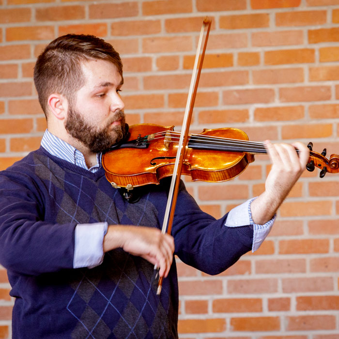 Fith-year senior Thomas Neely learns new approches form accomplished violinist Alexander Kerr.