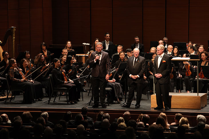 From left: Mark Blakeman addresses the audience during the Opening Gala alongside Ross McKnight and OSU President Burns Hargis.