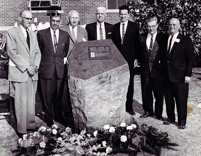 The Kappa Kappa Psi shrine, dedicated March 26, 1960, resides at the west end of the Classroom Building at OSU. Pictured during the 1960 dedication: Clyde Haston, Iron Nelson, Carl Stevens, Dick Hurst, Dr. Robert MacVicar, Clayton Soule and A. Frank Martin.