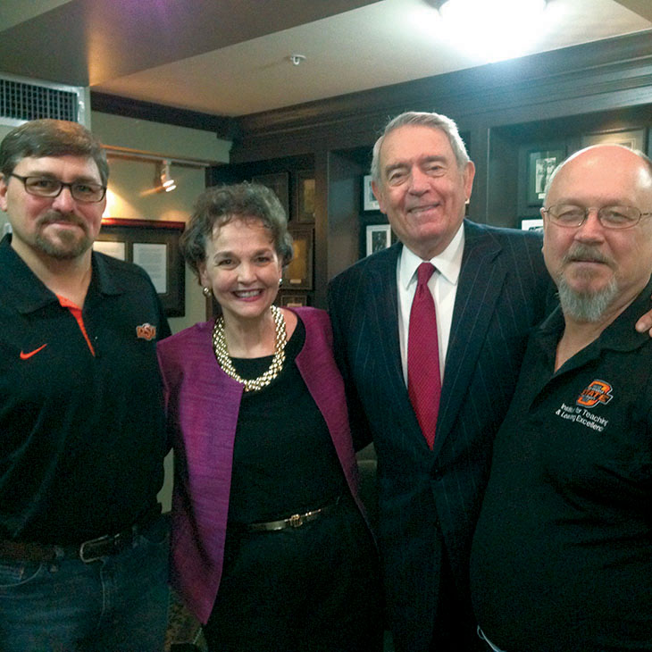 Teresa Miller with (from left) Rick Eggers, Dan Rather and Gary John.