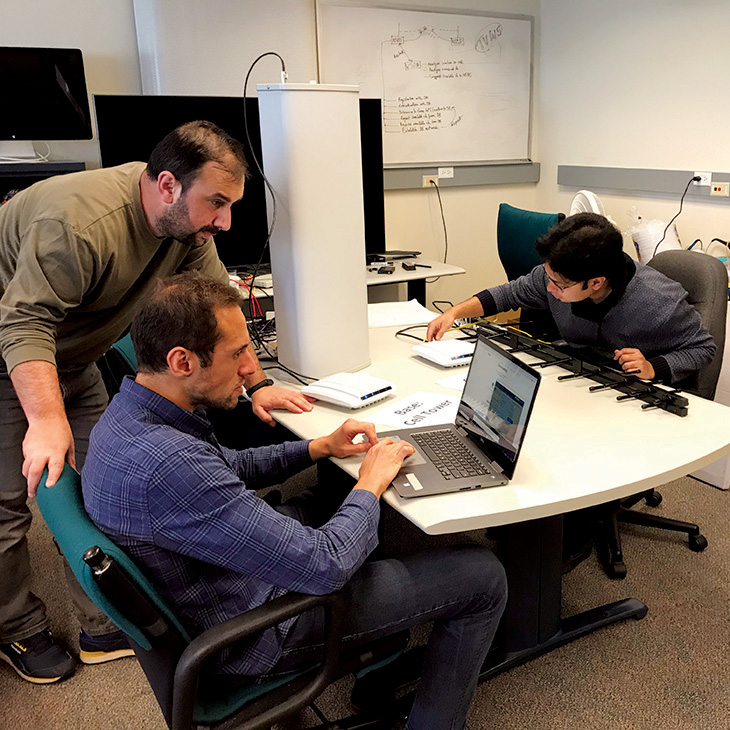 Men working at computer