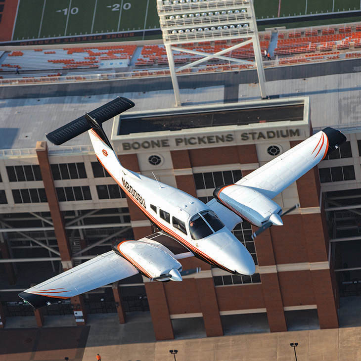 plane flying over boone pickens stadium