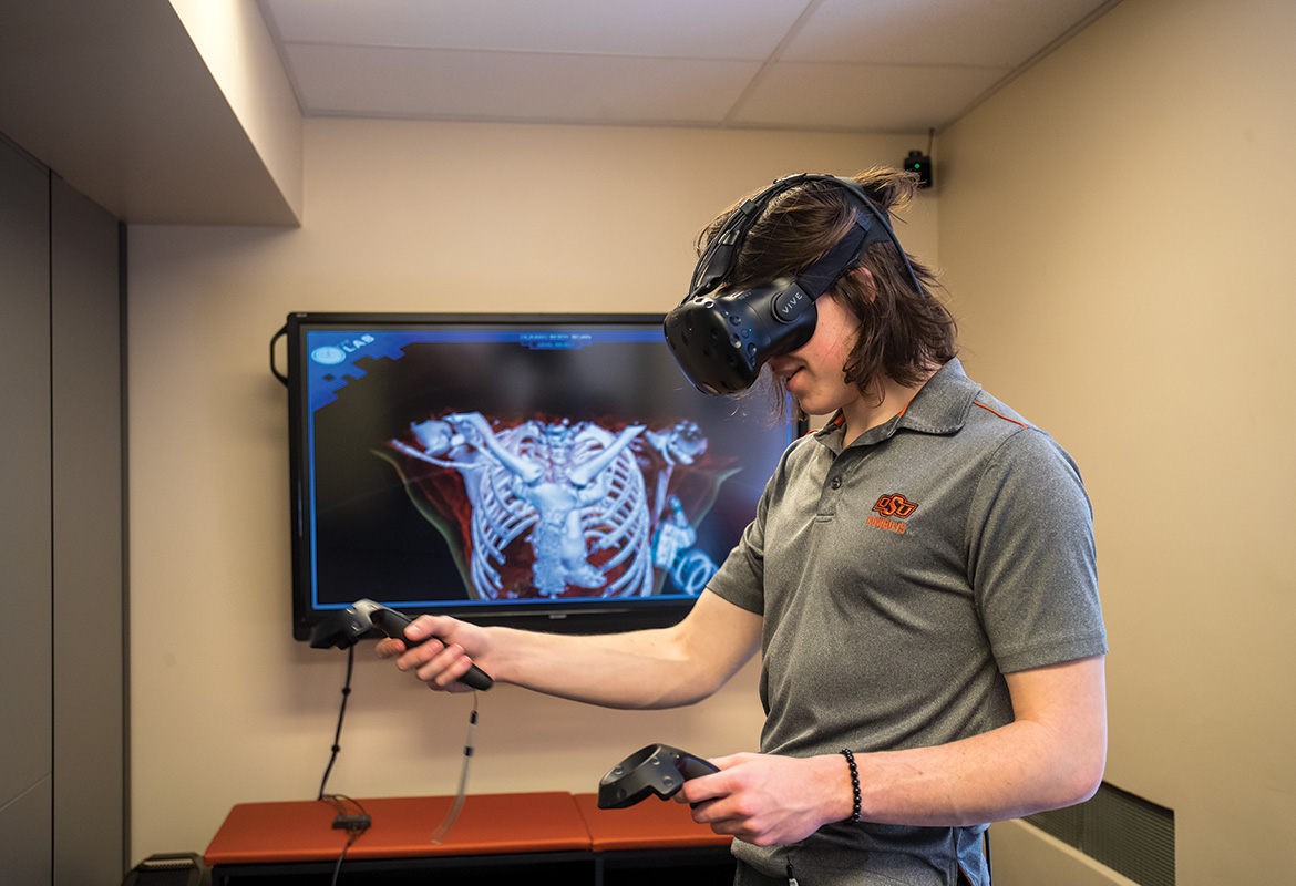 A student explores a skeleton using virtual reality at the Creative Studios. The studios currently have four Oculus Quest VR systems available to students.
