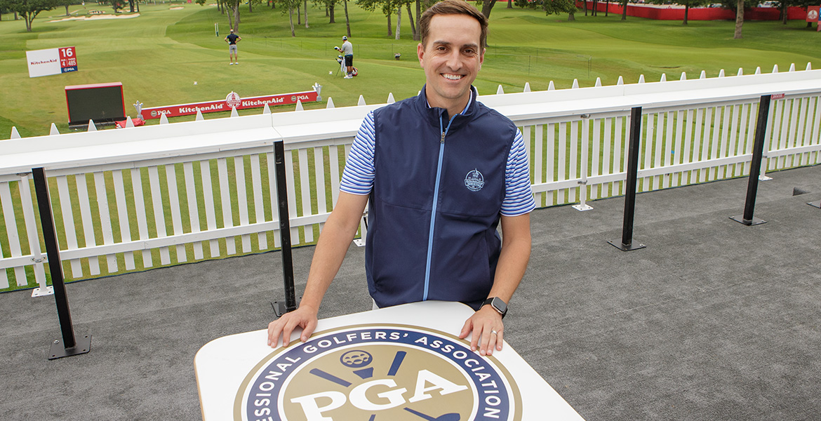 bryan karns in front of PGA sign