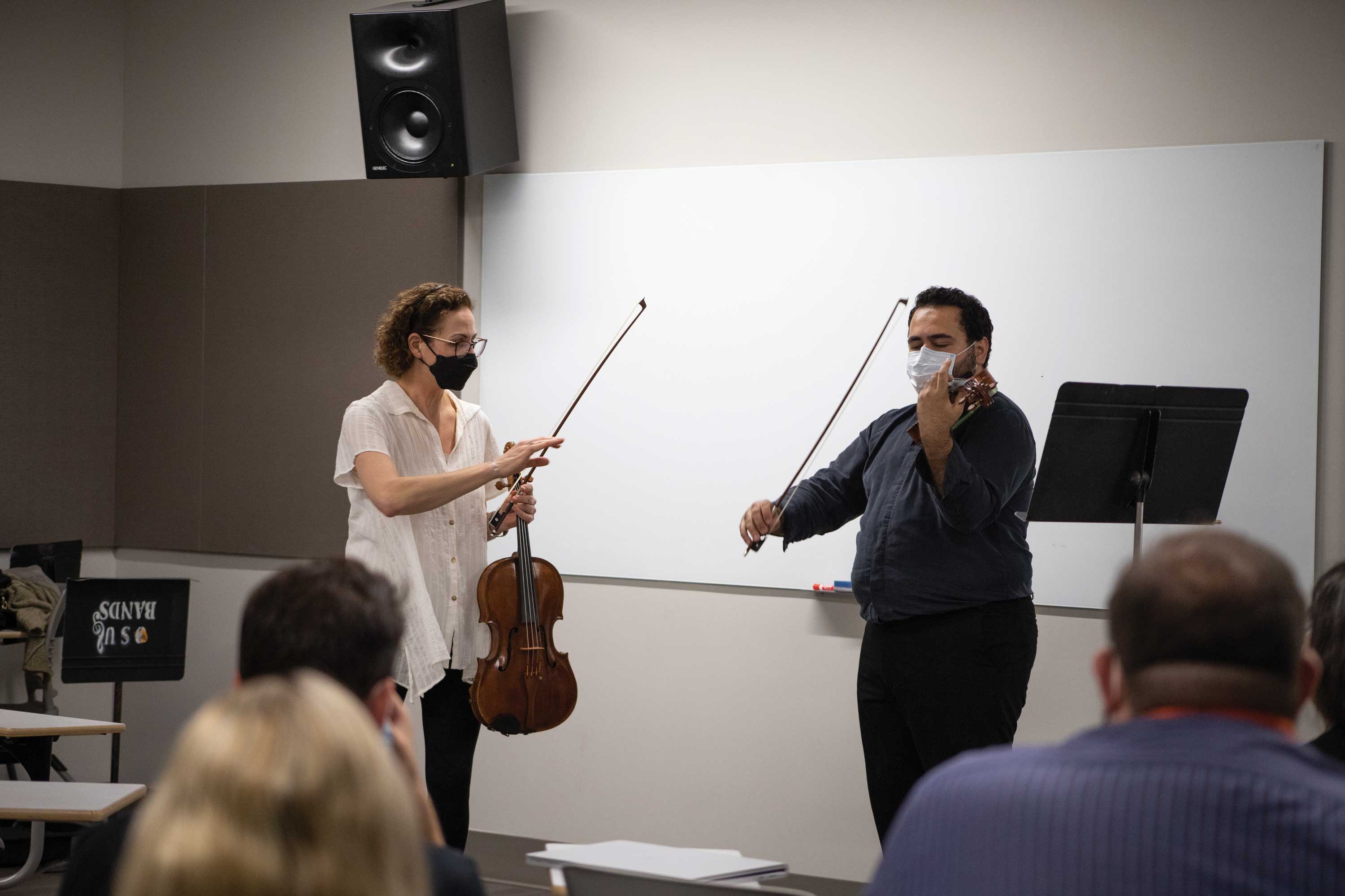 Principal viola Rebecca Young works with a student at the Greenwood School of Music.