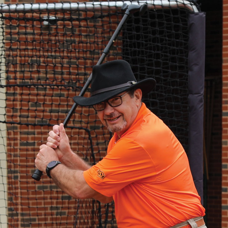 A Heritage Society member gets into his batting stance during the O’Brate Stadium tour.