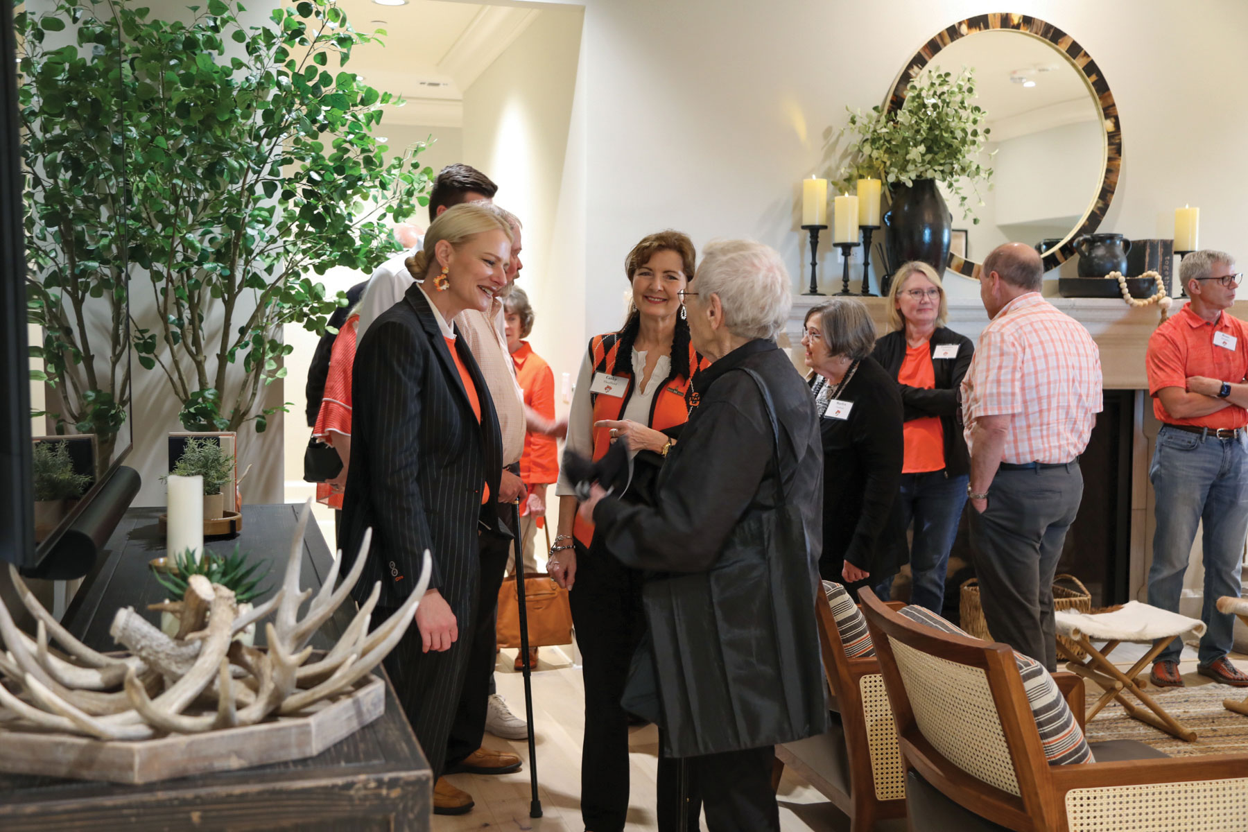 President Shrum spends time chatting with donors during their walkthrough of the University House.