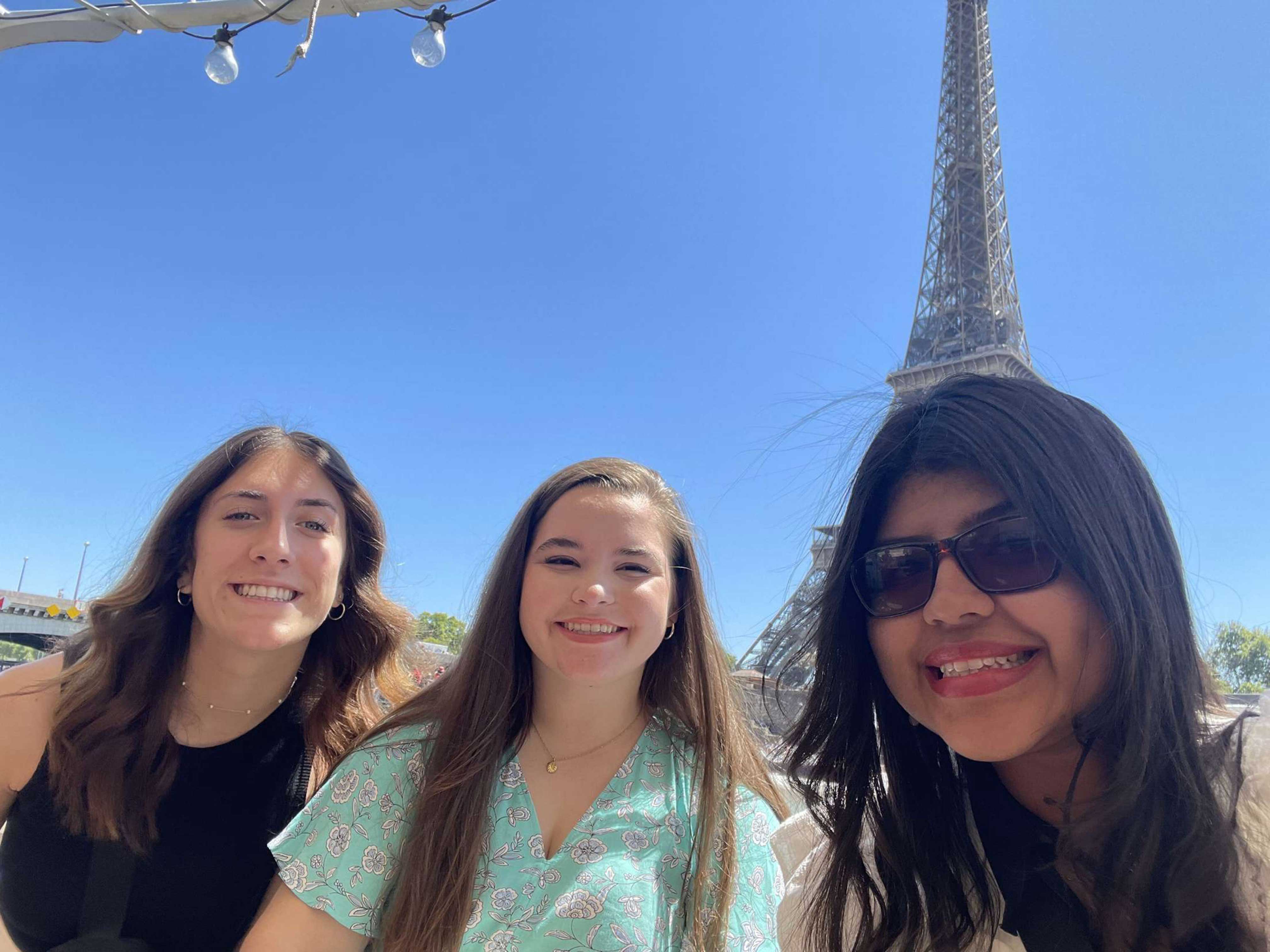 From left: Tatum Newberry, Kalissa Moseley and Leslie Rodriguez visit the Eiffel Tower while in Paris.