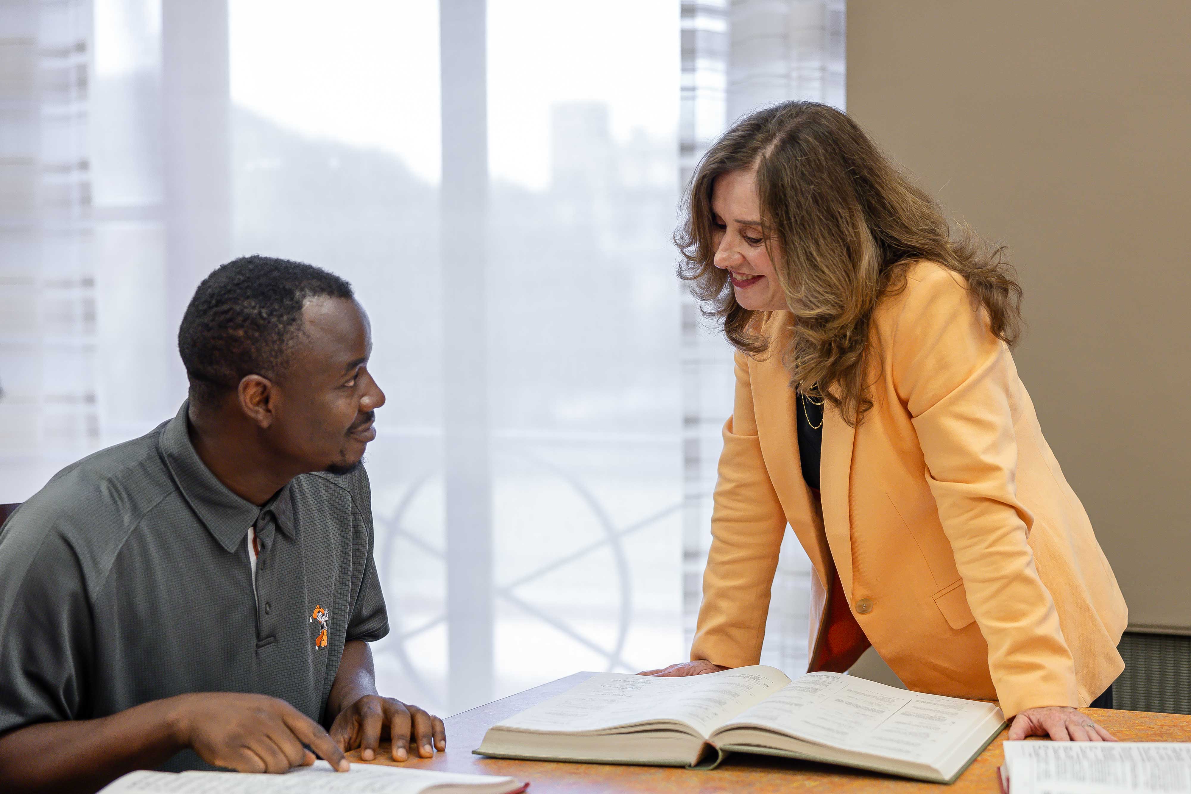 Dr. Melanie Morgan works with a student.