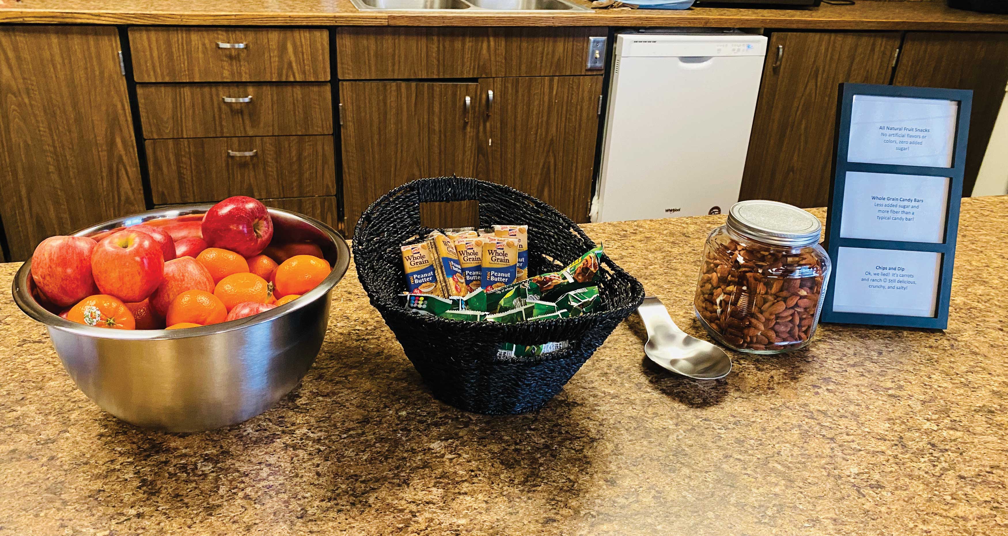 three baskets of healthy snacks sit on a table