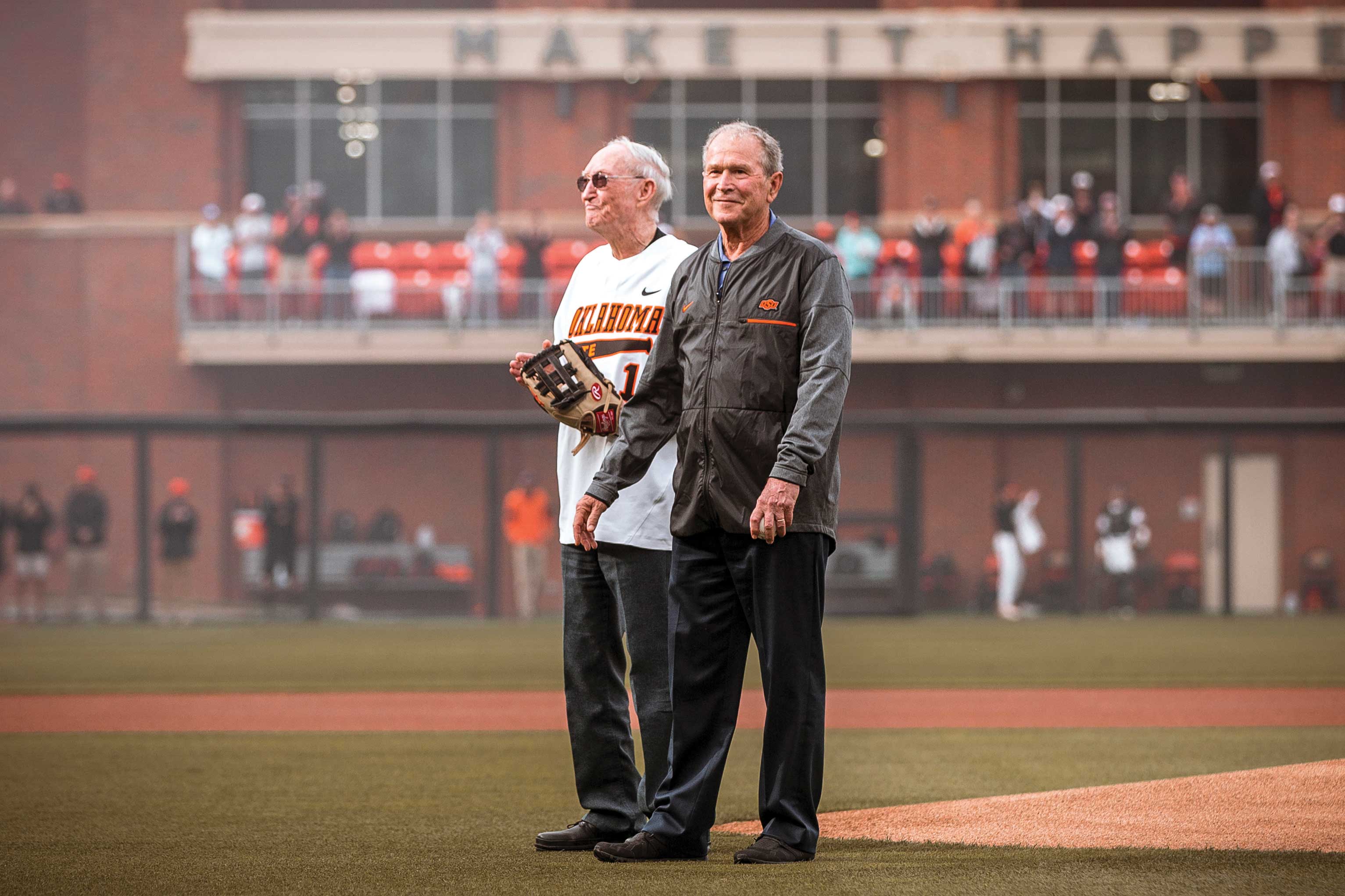 Cecil O’Brate and former U.S. President George W. Bush throw out the first pitch at O’Brate Stadium in 2021.