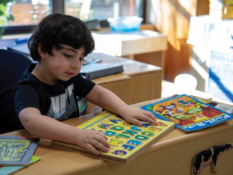 a child plays with books