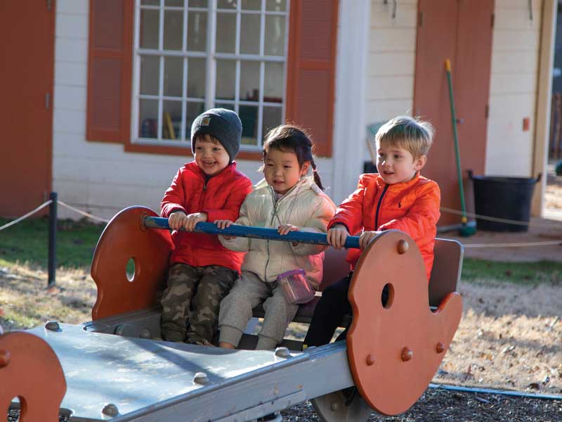 3 children play outside