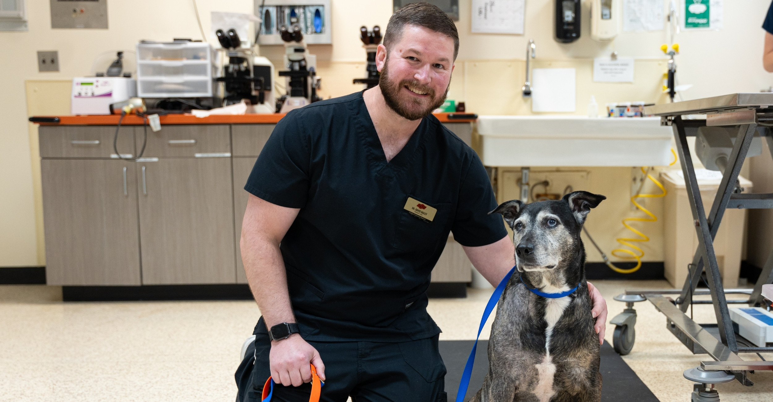Dr. Bailey posed next to Pico the dog at the OSU veterinary teaching hospital.