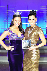 Miss OSU Michelle Langford receives a rookie talent award during preliminary competition from Miss Oklahoma 2012 Alicia Clifton during the Miss Oklahoma Pageant held in Tulsa, Okla. from June 3-8. Langford, who is a senior at OSU, was also awarded a non-finalist talent award. In all Miss OSU received $5,000 in scholarships during the week long competition. Seven OSU students competed in the pageant, including Aly Akers who won a preliminary talent award and was selected in the top 11.