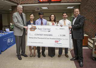 AAA Oklahoma presents the OSU App Center interns with a check for the $21,500 in prize money offered in this year's app competition. From left: Neal Krueger, President & CEO of AAA Oklahoma; App Center interns June Phan, Dheeraj Jami, Ale Cerqueda, Stefan Taylor and CSAA Insurance Group Senior Manager Will Dogan.