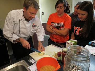 UDS Executive Chef Donald Pritchett hosts a Healthy Dining cooking class in a residence hall. Students learn simple cooking techniques that allow them to cook their own quick, healthy meals.