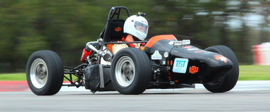 OKstate Racing team’s natural gas powered car crosses the finish line under fogging conditions to set a new world mileage and endurance record after 24-hours at the Hallett Racing Circuit.