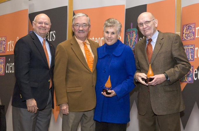 OSU recognized Joe and Sue Williams and Lee Manzer as winners of the Loyal and True Award at Wednesday’s University Awards Convocation. The honor goes to individuals who personify the spirit of OSU through unwavering devotion, personal sacrifice and commitment of time and talents well above and beyond what is reasonably expected. Pictured, from left, are Gary Clark, OSU vice president who helped present the award, Joe Williams, Sue Williams and Manzer.