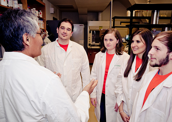 A new program at Oklahoma State University is giving minority students a boost in the science professions. Called The Science Scholars: the Native American Path, the program guides American Indian students at OSU in pursuing degrees in science, technology, and engineering and mathematical fields. From left are OSU associate professor of microbiology and molecular genetics Gilbert John who oversees the program with Josh McCloud, botany graduate student, Weleetka, Okla.; Amanda Mathias, animal science senior, Inola, Okla.; Amber Anderson, biochemistry and molecular biology senior, Warr Acres, Okla.; and Alex Hardison, biological science, Owasso, Texas. Photo courtesy of SACNAS.org and Tyler Siems Photography.