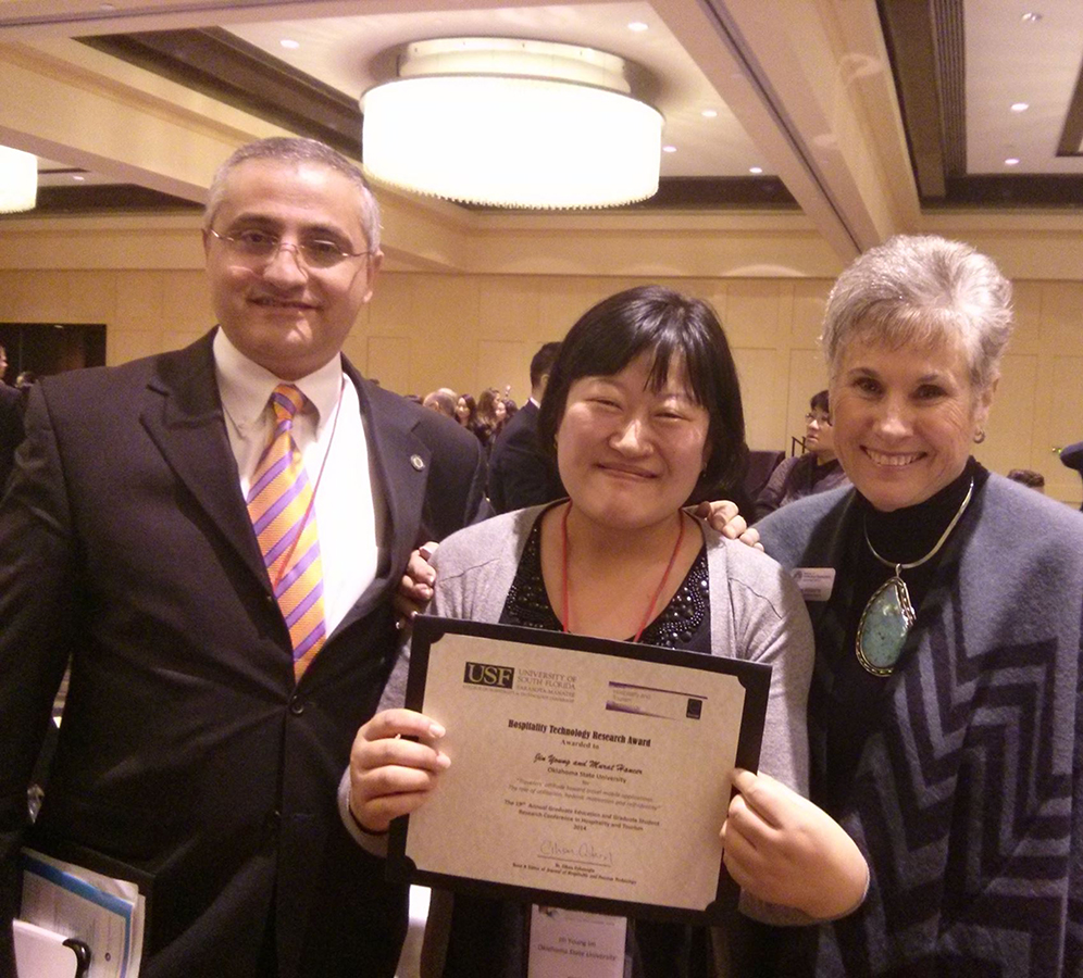 From Left: School of Hotel and Restaurant Administration Professor Murat Hancer, doctoral student Jin Young Im and HRAD Interim-director Sue Williams celebrate best paper award presentation at the Graduate Education & Graduate Student Research Conference in Hospitality and Tourism in Houston, Tex.