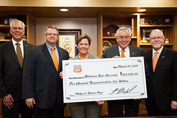 Phillips 66 executives and OSU alumni H.J. Reed (far left) and Ann Oglesby (center) presented the corporation’s $500,000 check to OSU. Accepting on the university’s behalf were Dean Paul Tikalsky (second from the left) of the College of Engineering, Architecture and Technology; Provost Gary Sandefur (second from the right); and OSU Foundation President Kirk Jewell.