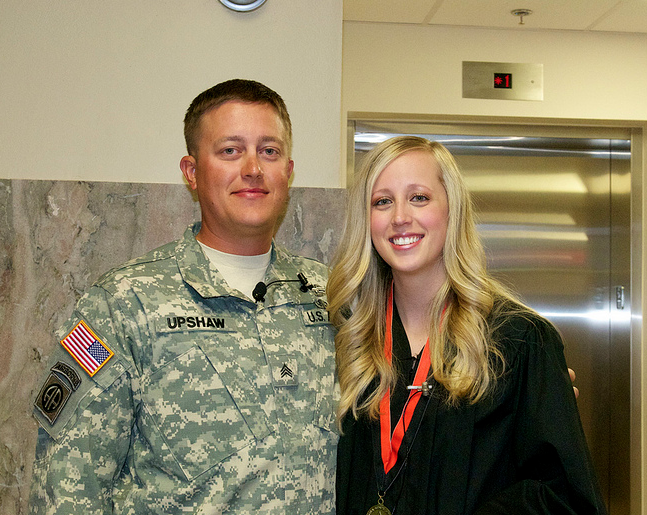 Sgt. Chris Upshaw of the U.S. Army flew to Stillwater from Guam to surprise his sister, Lauren Reid, prior to her graduation from Oklahoma State University's Spears School of Business on Saturday, May 4. Reid, from Perry, Okla., graduated with a general business degree. Sgt. Upshaw is deployed to Camp Covington on the Naval Base Guam. He surprised his sister by showing up at the Spears School's reception for graduates Saturday morning in the Student Union Ballroom.