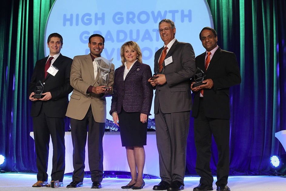 Oklahoma Gov. Mary Fallin (center) recognizes the R2R Technologies team members, from left, Aravind Seshadri, Pedro Velasco, Carlo Branca and Prabhakar Pagilla, professor of engineering, at the 2013 Oklahoma Governor’s Cup.