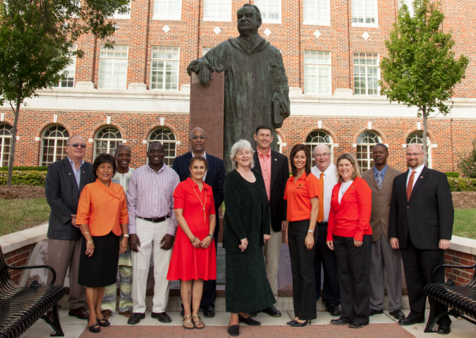 Oklahoma State University colleagues gather at the Henry G. Bennett statue on the OSU campus to celebrate their new Department of State Bureau of Educational and Cultural Affairs grant award. Bennett’s statue symbolizes Oklahoma State University’s long-standing commitment to international education, research and outreach. Project team members include Craig Edwards (back left), professor of agricultural education and graduate coordinator; graduate student Assoumane Maiga from Mali; Stephen Mukembo, project graduate assistant from Uganda; Craig Watters, interim director of the Riata Center for Entrepreneurship; Rob Terry, department head of agricultural education, communications and leadership; David Henneberry, associate vice president of International Studies and Outreach; graduate student Fred Matofari of Kenya; Dwayne Cartmell, professor of agricultural communications; Adel Tongco (front left), interim director of international agriculture programs; Shida Henneberry, Master of International Agriculture program director; Lisa Taylor, Muskogee County Extension educator; Brentney Maroney, project graduate assistant; and Shelly Sitton, professor of agricultural communications.