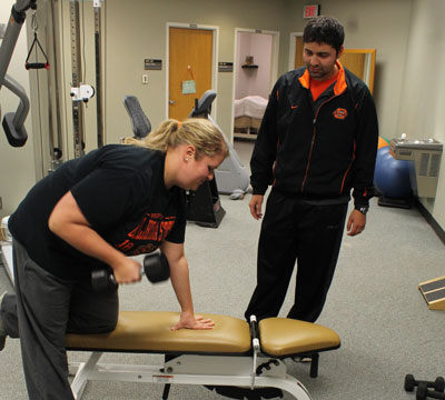 Lindsay Starkey works with a personal trainer at the Seretean Wellness Center