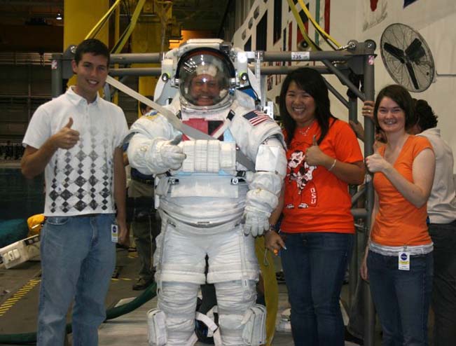 From left: OSU students Cory Sudduth, Khanh Lu, and Kristin Nevels meeting astronaut Michael Fincke.