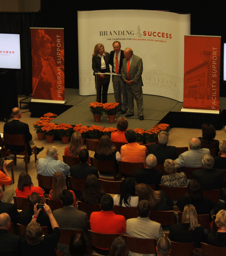 President Hargis, along with Ross and Billie McKnight, announce the updated Branding Success total at a ceremony in the Student Union.