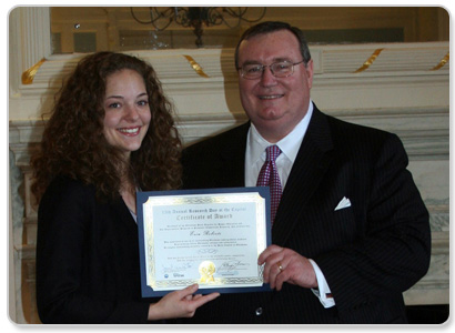 Erin Roberts of Oklahoma City, shown with Chancellor Glen D. Johnson, won third place in the research intensive campus category