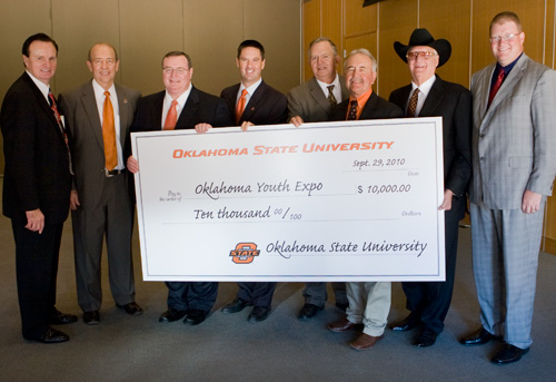 Oklahoma State University and the Oklahoma Youth Expo have partnered to provide four $5,000 scholarships to high school seniors. OSU will provide two $5,000 scholarships which will be matched by the OYE for a total of $20,000. Pictured from left to right are Jimmy Harrel, Robert Whitson, Glen Johnson, Kyle Wray, Jack Staats, Terry Peach, Bob Funk and Jeramy Rich.