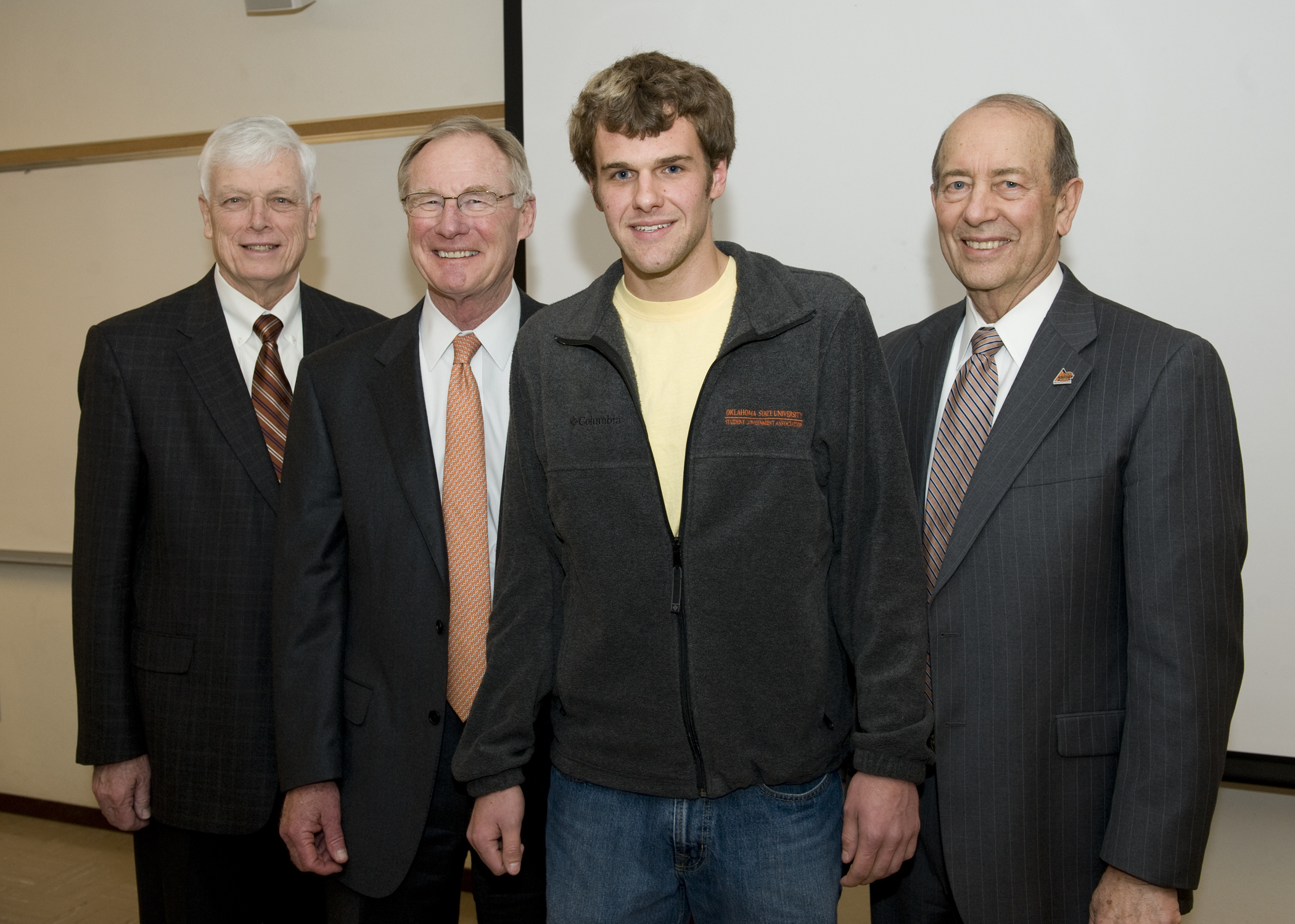 Oklahoma State University junior Flint Holbrook is congratulated by OSU Dean of Engineering Karl Reid (far left),OSU President Burns Hargis and OSU Dean of Agriculture Robert Whitson (far right) on being chosen one of the nation’s 80 students to win the Morris K. Udall Foundation Scholarship. Holbrook, who is a biosystems engineering major from Clover, South Carolina, was one of two OSU students to receive the honor. OSU junior Blake Jackson an agribusiness major from Hartshorne, Okla. was also named a Udall Scholar.