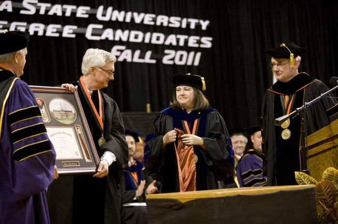 OSU President Burns Hargis, OSU/A&M Board of Regents Chair Jay Helm and Graduate College Dean Sheryl Tucker presented Donald D. Humphreys with an honorary Doctor of Humane Letters degree during Saturday's commencement ceremony. Humphreys, a native of Tulsa, earned a bachelor’s degree in industrial engineering and management from OSU in 1971.