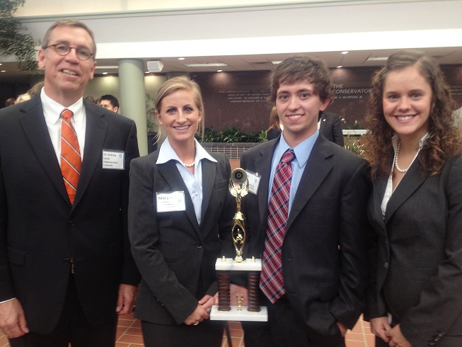 A team of three Oklahoma State University Spears School of Business Students placed second in the Oklahoma Student Ethics Challenge, which was held during the Oklahoma Business Ethics Consortium at Oklahoma Christian University on Oct. 29. Pictured, from left, are the team’s adviser, Andy Urich, and team members Mary Kate Barnthouse, Joe Tobias and Gina Hancock.