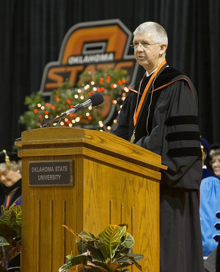 Oklahoma Supreme Court Chief Justice Steven W. Taylor addresses OSU graduates during one of two commencement ceremonies Saturday at Gallagher-Iba Arena in Stillwater. The McAlester native graduated from OSU in 1971 with a political science degree. More than 1,700 graduates were recognized during Graduate College and undergraduate ceremonies Friday and Saturday.