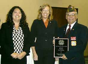 (l-r) Mackenzie Wilfong and Jamie Payne from OSU accept the VFW large employer of the year award from State Commander Emmitt Humphrey.