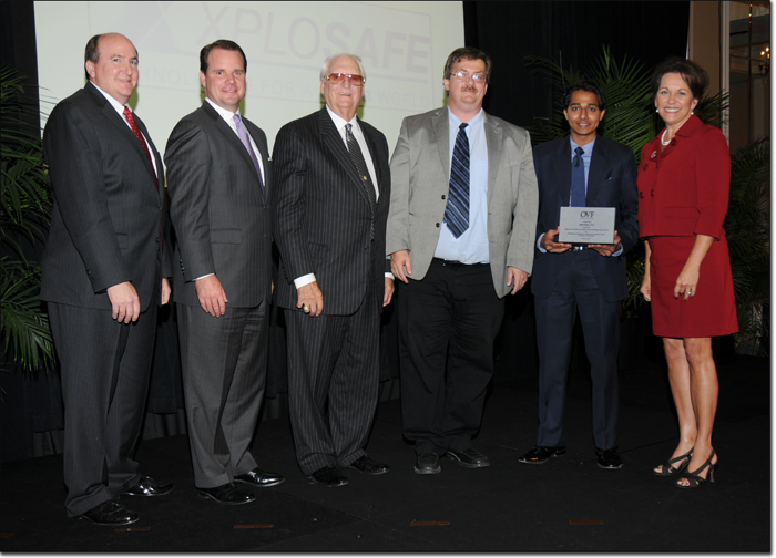 Dr. Allen Apblett and Shoaib Shaikh accept XploSafe’s award as one of Oklahoma’s Most Promising New Business Ventures. Pictured from left to right are: J. Clay Christensen, OVF chairman and director of Christensen Law Group, PLLC; Oklahoma Lt. Governor Todd Lamb; Robert A. Funk, CEO and Chairman of the Board at Express Employment Professionals; Dr. Allen Apblett; Shoaib Shaikh; and Cindy Friedemann, OVF secretary and chief officer for strategy and market development at Metro Technology Centers.